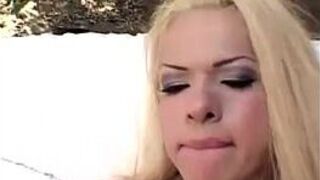 Luscious blonde shemale gets a messy facial - porn video